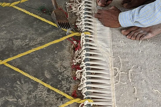 Step 4 - Following a was, rug is dried in the sun